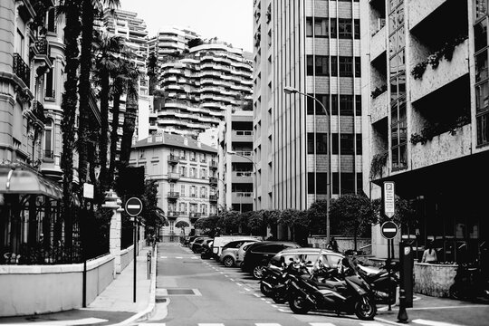 Black and white photo of cars parked in residential district of Monaco city
