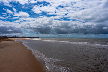seaside beach walkway. People walking on the pier
