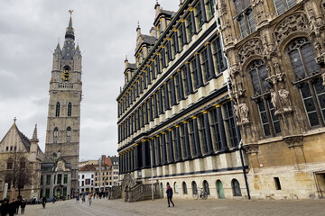 Tourists walking nearby the Het Belfort Van Gent church in Ghent, Belgium