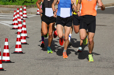 runners during the marathon on the city streets run in sneakers