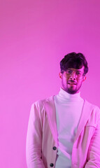 Overwhelmed face. Skeptic look. Question expression. Pink color neon light portrait of perplexed scared puzzled confused man on empty space background.