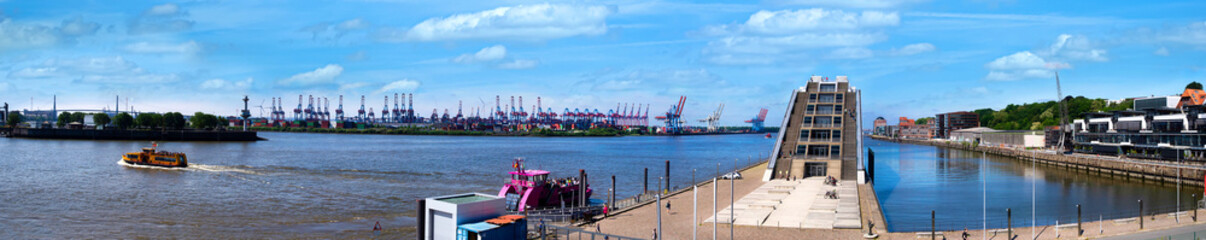 Dockland office building at Dockland Ferry Wharf (Fischereihafen). A large trapezoid building...