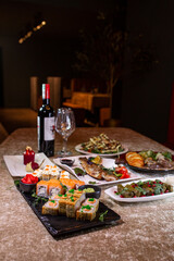 romantic dinner of various dishes on the table in the restaurant