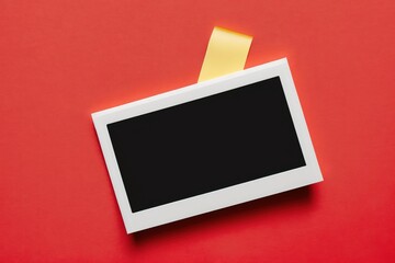 photo mockup taped on red color wall