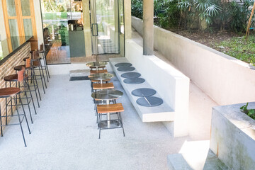 Circular metal table and chair at restaurant.
