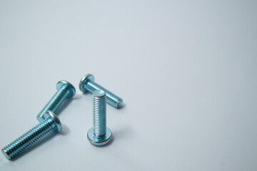 Steel screw. Screws on white background. Some metal machine screw bolts on white background.