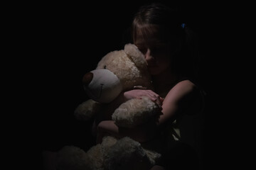 Conceptual image: Lost childhood. Psychological portrait of upset, scared and lonely young girl...