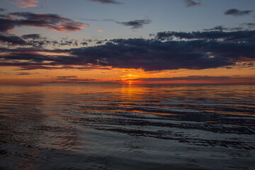Fototapeta na wymiar Sunset over calm ocean