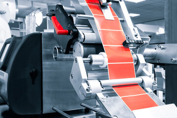 Fragment of the conveyor of sticking labeling machine. Abstract industrial background. - obrazy, fototapety, plakaty
