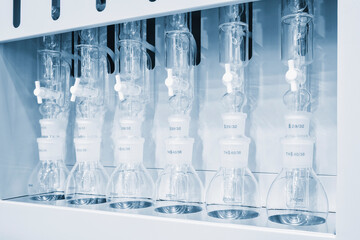 Laboratory research scientific glassware for chemical background. Medical or chemical background with laboratory equipment and liquids.