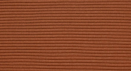 Texture of brown knitted fabric as background