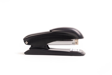 a dark metal stapler. close-up. on a white background.