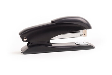 a dark metal stapler. close-up. on a white background.