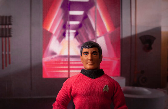 NEW YORK USA, MAY 22 2019: Portrait of USS Enterprise Chief Engineer Montgomery Scott aka Scotty sanding in front of the warp core in the Engineering section. Vintage Mego action figure.
