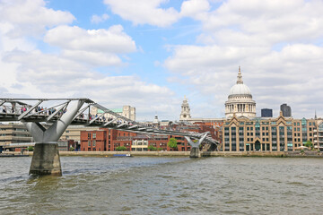 Fototapeta na wymiar Millennium bridge across the River Thames, London