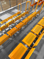 View of yellow seats in stadium