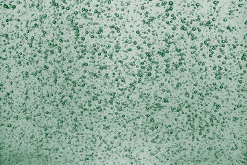 Bubble green emerald texture background little shampoo bubbles.
