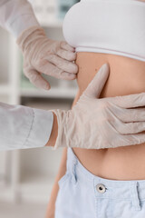 Obraz premium Doctor examining patient's skin for moles and skin cancer, medical checkup and dermatology consultation, this dermatology consultation emphasizes early detection and prevention of skin diseases