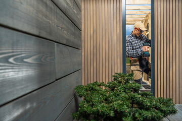 Modern Custom Garden Shed Building Performed by Construction Worker