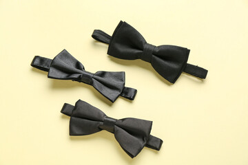 Set of stylish bow ties on color background