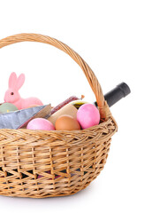 Basket with Easter eggs, bottle of wine and bunny isolated on white background