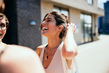 Woman laughing with friends after yoga