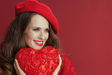 smiling modern woman in red sweater and beret