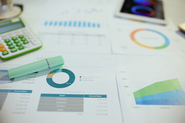 Fototapeta premium tax time. calculator, documents and graphs at desk.