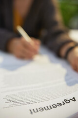 woman reading agreement document