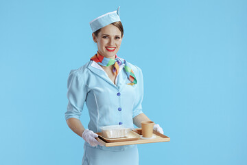 smiling modern air hostess woman on blue