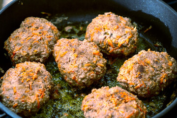 close-up, cooking meatballs in a frying pan