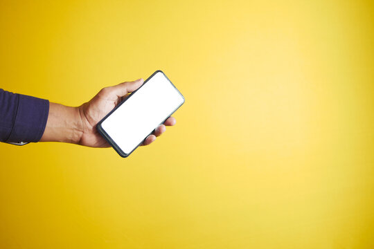  Young Man Hand Holding Smart Phone With Empty Screen 