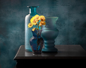 blue vases with yellow flowers still life © MICKEY