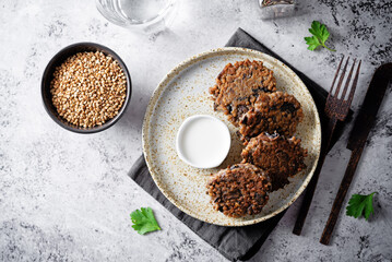 Buckwheat mushroom fritters in a plate with sauce