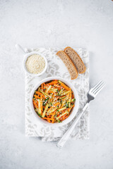 Asian cucumber carrot salad with sesame seeds in a bowl