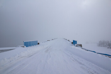 Fototapeta na wymiar Winter view of Rila mountain near Belmeken Dam, Bulgaria