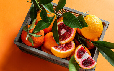 Box with red oranges. Fruit banner. Harvest, abundance, juicy