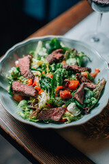 warm salad with herbs and vegetables with red wine