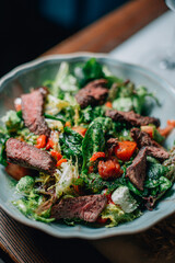 warm salad with herbs and vegetables with red wine