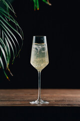 glass of champagne on black background