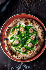 unusual pizza with shrimp and seaweed