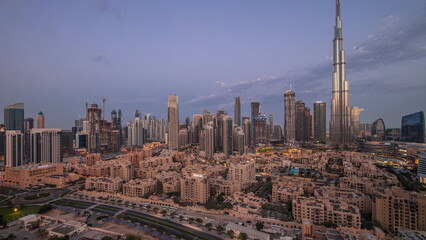 Fototapeta na wymiar Dubai Downtown night to day timelapse with tallest skyscraper and other towers