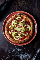Pizza with avacado, jalapeno and pomegranate seeds