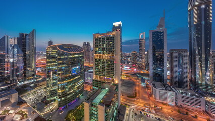 Fototapeta na wymiar Dubai international financial center skyscrapers aerial day to night timelapse.