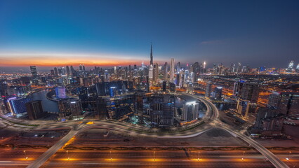 Fototapeta na wymiar Panoramic skyline of Dubai with business bay and downtown district day to night timelapse.