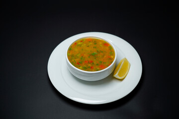Vegetable Soup isolated on black background