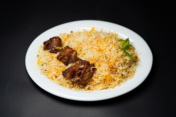 mutton biryani isolated on plate black background
