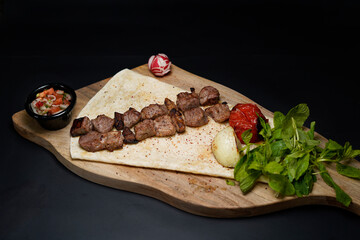 Tikka Kebab Barbecue juicy and delicious isolated on black background