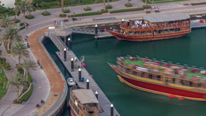Naklejka premium Old wooden ship near waterfront promenade aerial timelapse.