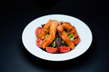 Crispy Chicken Salad isolated black background